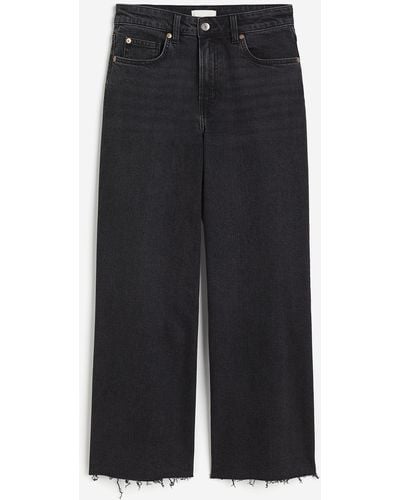 H&M Wide High Ankle Jeans - Schwarz