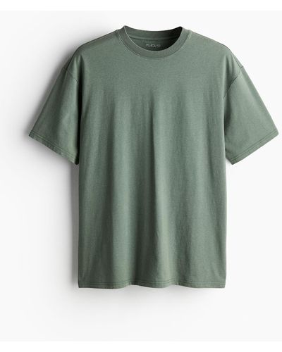 H&M DryMove Baumwollartiges Sport-T-Shirt Loose Fit - Grün