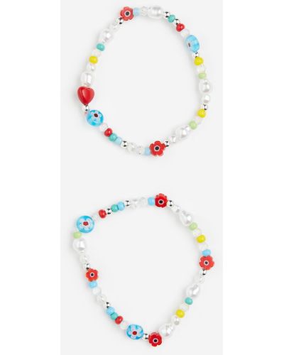 H&M 2er-Pack Armbänder mit Perlen - Weiß