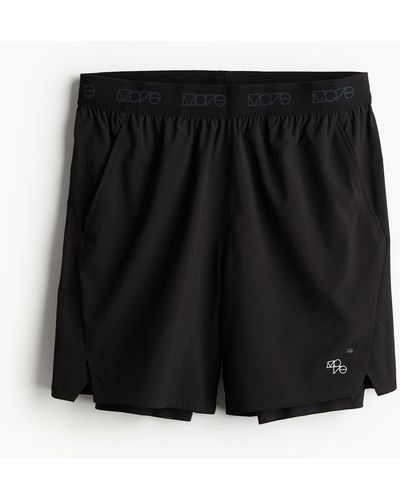 H&M Short de sport 2-en-1 DryMove 4-way stretch - Noir