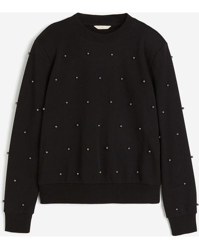 H&M Sweatshirt mit Perlenstickereien - Schwarz