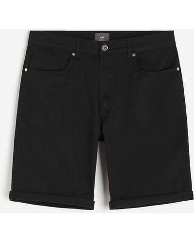 H&M Shorts aus Baumwolltwill Slim Fit - Schwarz