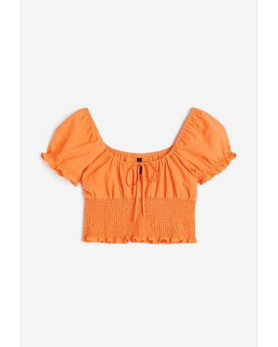 H&M Gesmokte Bluse mit Puffärmeln - Orange