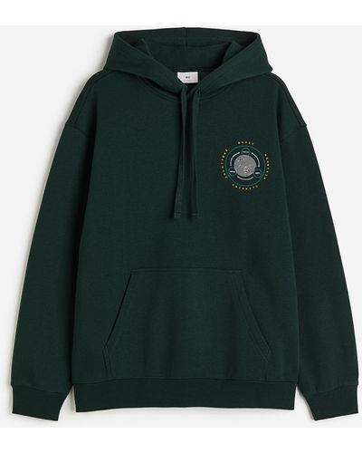 H&M Hoodie imprimé Loose Fit - Vert