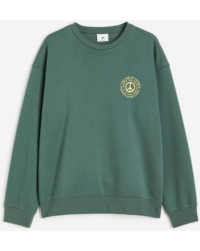 H&M Bedrucktes Sweatshirt in Loose Fit - Grün