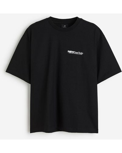 H&M Bedrucktes T-Shirt in Oversized Fit - Schwarz