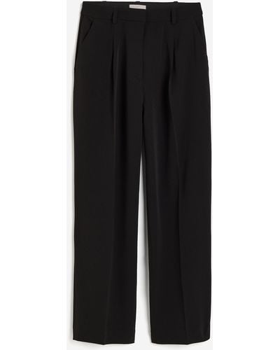 H&M Pantalon large avec plis marqués - Noir