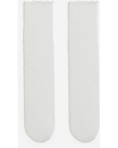H&M Chaussettes scintillantes en mesh - Blanc