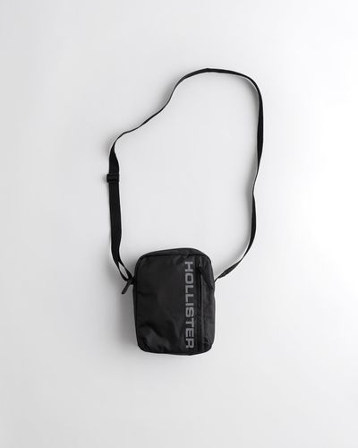 Hollister Umhängetasche mit auf den Blitz deiner Kamera reagierendem Logo - Schwarz