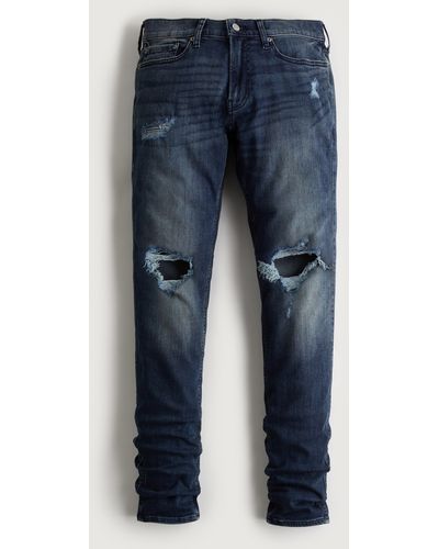 Hollister Stacked Skinny Jeans in dunkler Waschung mit Rissen - Blau