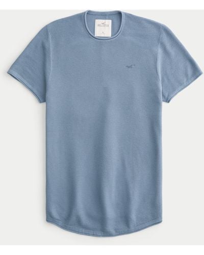 Hollister T-Shirt mit Rundhalsausschnitt, abgerundetem Saum und Symbol - Blau