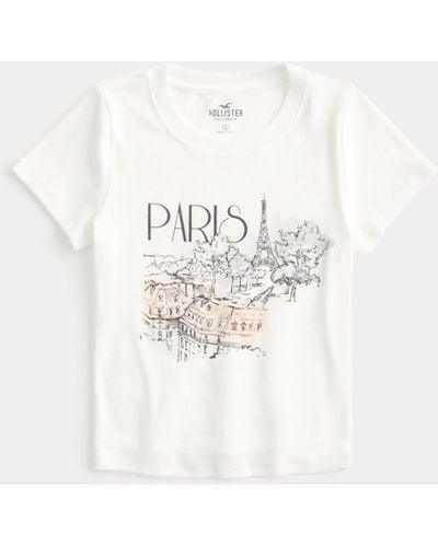 Hollister Kurzes Baby-Tee mit Paris-Grafik - Weiß
