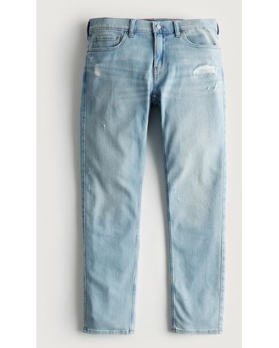 Hollister Leichte Slim Straight Jeans in heller Waschung und Distressed-Optik - Blau