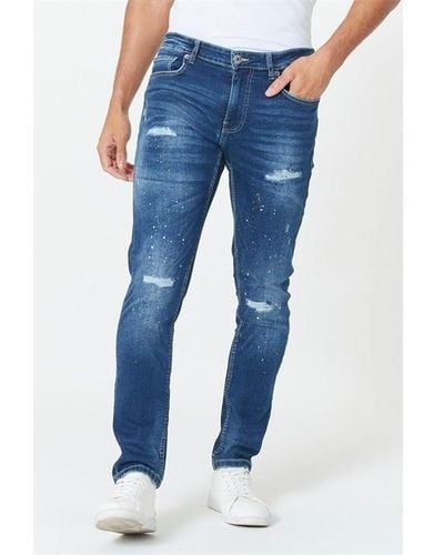 Studio Relaxed Tapered Fit Splatter Print Mid Wash Jeans - Blue