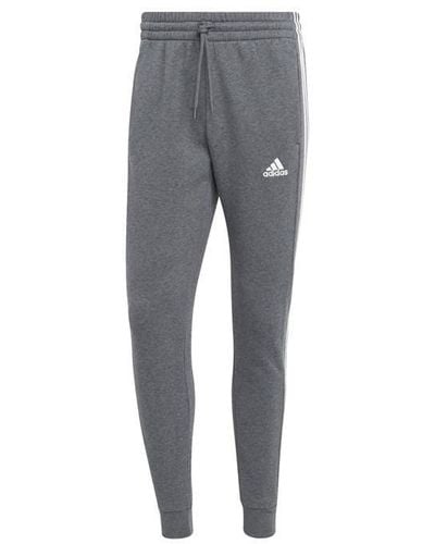adidas Essentials Fleece Tapered Cuff 3-stripes joggers M in Grey