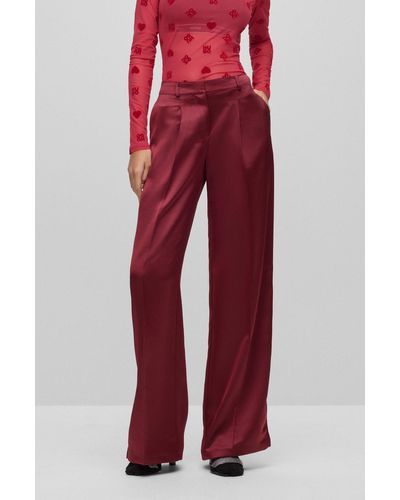 HUGO Pantaloni relaxed fit a gamba larga in morbido satin - Rosso