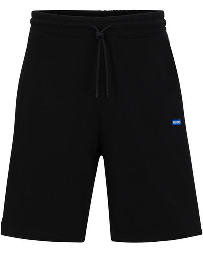 HUGO Shorts aus Baumwoll-Terry mit blauem Logo-Label - Schwarz