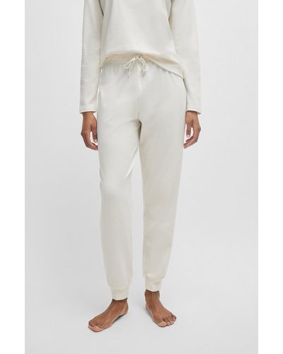 BOSS Pantaloni del pigiama in cotone elasticizzato con fondo gamba elastico e cordoncini brandizzati - Bianco