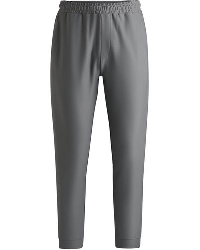 BOSS Jogginghose aus Stretch-Gewebe mit dekorativem reflektierendem Logo - Grau