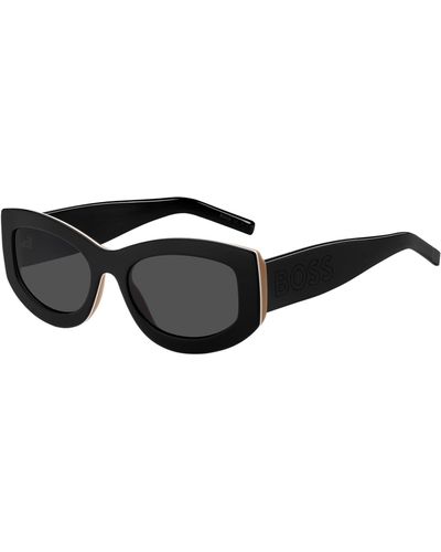 BOSS Sonnenbrille aus Bio-Acetat mit charakteristischen Streifen und großem Logo am Bügel - Schwarz
