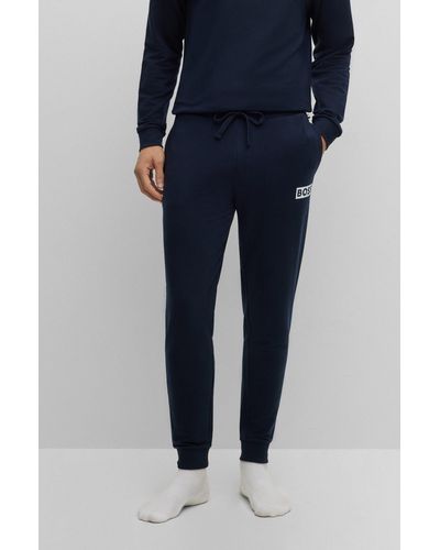 BOSS Cuffed Tracksuit Bottoms In French Terry With Logo Print - Blue