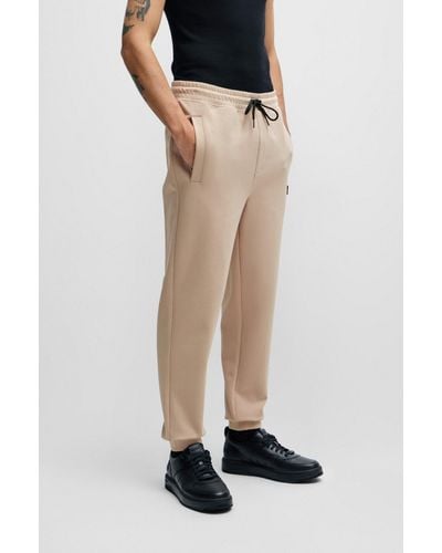 HUGO Pantalones de chándal en felpa de algodón elástico con logo apilado - Neutro