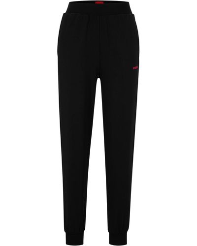 HUGO Jogginghose aus gebürstetem Jersey mit Logo und Beinbündchen - Schwarz