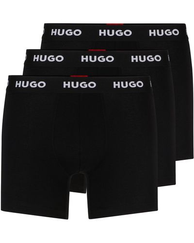 HUGO Paquete de tres calzoncillos bóxer en algodón elástico con logos en la cintura - Negro