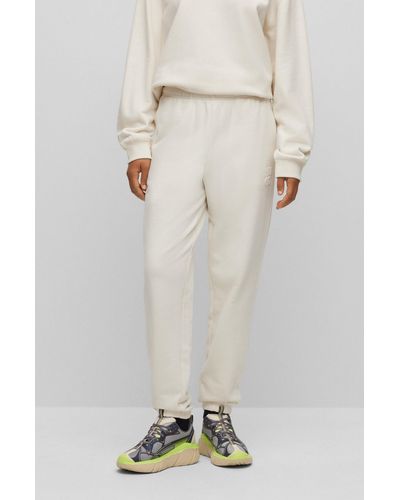 HUGO Relaxed-fit Tracksuit Bottoms With Embossed Stacked Logo - White