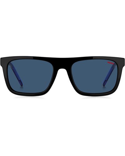 HUGO Sonnenbrille aus schwarzem Acetat mit blau getönten Gläsern