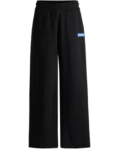 HUGO Relaxed-fit Tracksuit Bottoms With Logo Print - Black