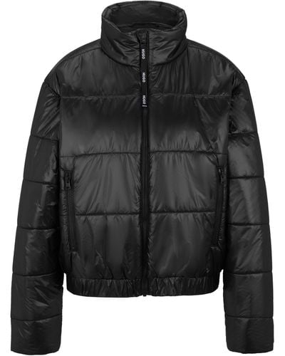 HUGO Wasserabweisende Relaxed-Fit Jacke mit rotem Logo-Etikett - Schwarz