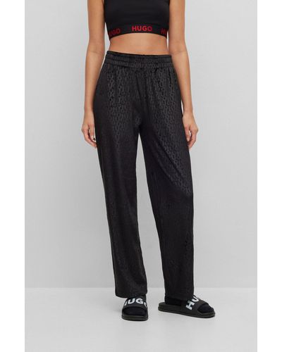 HUGO Pantalones homewear de corte recto en velur con logo estampado - Negro