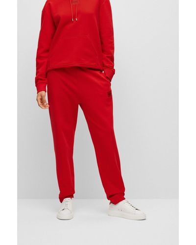 HUGO Pantalones de chándal en felpa de algodón con etiqueta con logo - Rojo