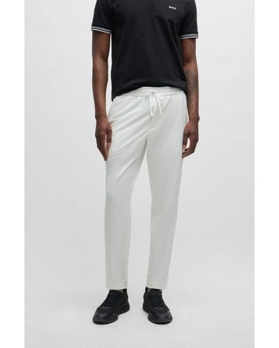 BOSS Tapered-fit Chinos In Easy-iron Four-way Stretch Fabric - White