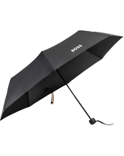 BOSS Mini parapluie avec sangle de fermeture à rayures emblématiques - Noir