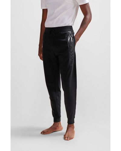 BOSS Pantaloni della tuta con fondo gamba elastico in french terry con logo stampato - Nero