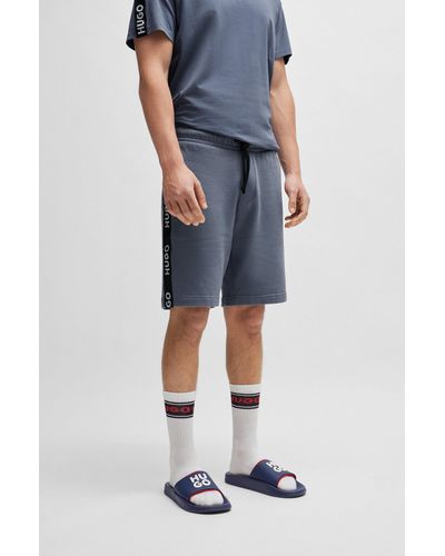 HUGO Short en molleton de coton avec logos brodés et taille à cordon de serrage - Bleu