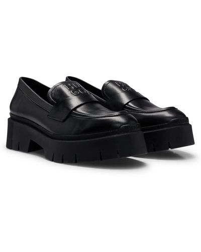 HUGO Loafers aus Glattleder mit dicken Sohlen und Logo-Details - Schwarz