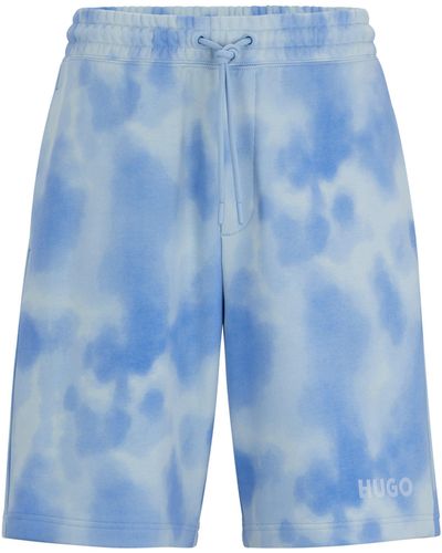 HUGO Relaxed-Fit Shorts aus Baumwoll-Terry mit Print der Saison - Blau