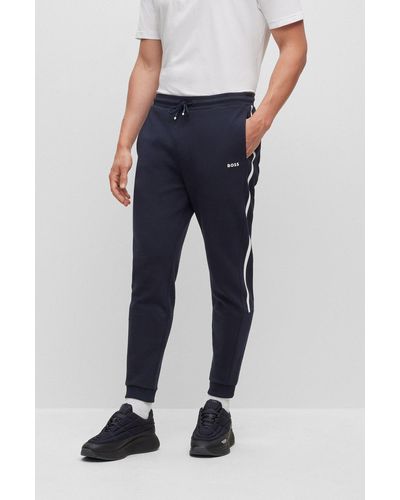 BOSS - Pantalones de chándal en felpa de algodón con raya y logo