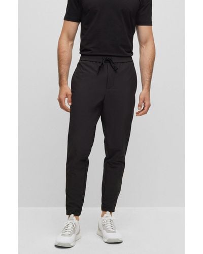 BOSS Tapered-fit Chinos In Easy-iron Four-way Stretch Fabric - Black