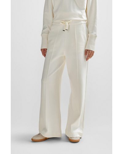 BOSS Pantalones tapered fit de algodón con cordón en la cintura y ribetes de cinta - Blanco