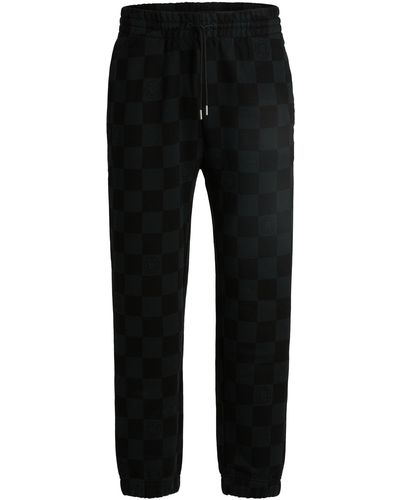 HUGO Loose-fit Tracksuit Bottoms With Checkerboard Print - Black