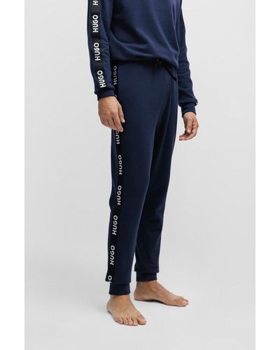 HUGO Pantalones de chándal de algodón con puños en los bajos y cinta de logos - Azul