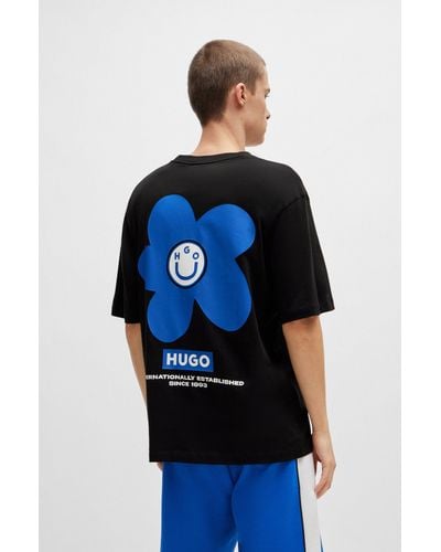 HUGO T-shirt en jersey de coton avec logo artistique à fleurs - Noir