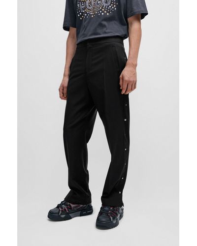 HUGO Pantalon Slim Fit avec coutures latérales cloutées - Noir