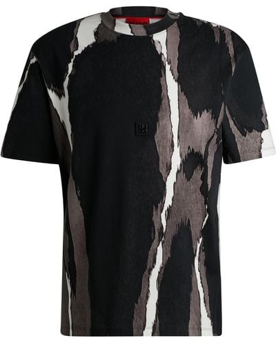 HUGO T-Shirt aus Baumwoll-Jersey mit saisonalem Print und Stack-Logo - Schwarz