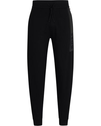 BOSS Jogginghose aus French Terry mit Beinbündchen und Logo-Print - Schwarz