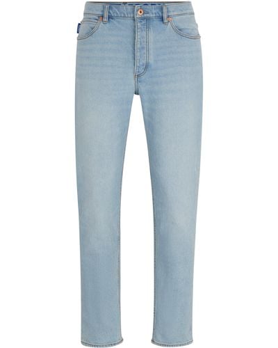 HUGO Hellblaue Tapered-Fit Jeans aus Stretch-Denim